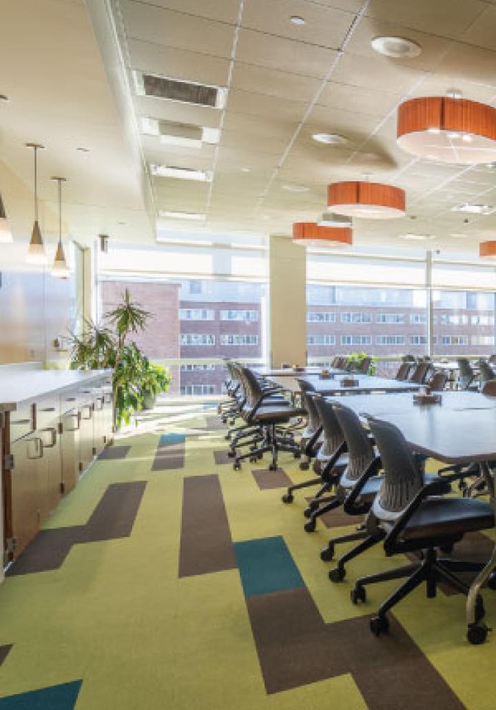 Conference room in Brody Square with tables and chairs